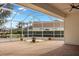 Relaxing screened patio with brick pavers and lush landscaping at 2957 Wilderness E Blvd, Parrish, FL 34219