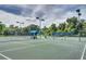 Well-maintained tennis court with surrounding fence at 2957 Wilderness E Blvd, Parrish, FL 34219