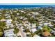 Aerial view showing a house's location in a residential neighborhood close to the ocean at 307 Spring Ave, Anna Maria, FL 34216