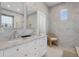 Elegant bathroom with double vanity and marble tile at 307 Spring Ave, Anna Maria, FL 34216