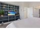 Bedroom featuring a built-in media center and a cozy bed at 307 Spring Ave, Anna Maria, FL 34216
