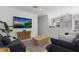 Open living room with sectional sofa and a view of the kitchen at 307 Spring Ave, Anna Maria, FL 34216
