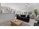 Bright living room with comfy seating and large windows at 307 Spring Ave, Anna Maria, FL 34216