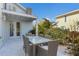 Outdoor dining area with table and chairs at 307 Spring Ave, Anna Maria, FL 34216