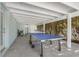Outdoor patio with ping pong table and covered area at 307 Spring Ave, Anna Maria, FL 34216