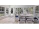 Relaxing sunroom featuring a table and chairs with garden views at 307 Spring Ave, Anna Maria, FL 34216