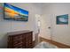 Bedroom with a dresser, hardwood floors and access to other rooms at 312 61St St # B, Holmes Beach, FL 34217
