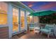 Cozy outdoor patio with comfortable seating and a large umbrella for shade with an outdoor view at 312 61St St # B, Holmes Beach, FL 34217