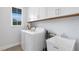 Clean laundry room with washer, dryer, and utility sink at 342 Via Anina Dr, Sarasota, FL 34243