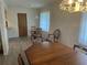Cozy dining area featuring a classic wood table and comfortable seating at 430 Botticelli Dr # 430, Nokomis, FL 34275