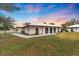 Charming single-story home featuring neutral stucco, arched doorways, and well-maintained landscaping at 430 Botticelli Dr # 430, Nokomis, FL 34275