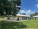 This single-story home boasts a white tile roof, neutral paint, and a well-maintained green lawn at 430 Botticelli Dr # 430, Nokomis, FL 34275