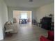 A spacious living room flows into the dining area, providing an open and inviting space at 430 Botticelli Dr # 430, Nokomis, FL 34275
