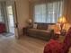 Inviting living room with natural light, neutral colors, and comfortable seating at 430 Botticelli Dr # 430, Nokomis, FL 34275