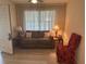 Comfortable living room with neutral color scheme and soft natural lighting at 430 Botticelli Dr # 430, Nokomis, FL 34275