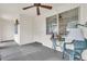 Covered porch with white walls, neutral carpet, ceiling fan, and furniture at 430 Botticelli Dr # 430, Nokomis, FL 34275