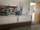 View of shelving unit with storage in a room with open doorway at 430 Botticelli Dr # 430, Nokomis, FL 34275