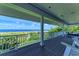 Beautiful home balcony offers stunning views of the ocean and landscaped grounds at 506 S Casey Key Rd, Nokomis, FL 34275