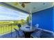 Enjoy ocean views on this large balcony with a fire pit and comfortable seating at 506 S Casey Key Rd, Nokomis, FL 34275
