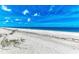 Gorgeous beach with clear blue waters and soft white sand provides a tranquil coastal experience at 506 S Casey Key Rd, Nokomis, FL 34275