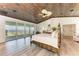 Large bedroom with ocean views and wood ceiling at 506 S Casey Key Rd, Nokomis, FL 34275