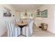 Inviting dining area with a round table and comfortable upholstered chairs at 506 S Casey Key Rd, Nokomis, FL 34275