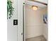 Interior view of the in-home elevator with white paneling and lighting at 506 S Casey Key Rd, Nokomis, FL 34275