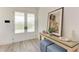 Bright foyer with wood floors, frosted glass doors, and a stylish console table at 506 S Casey Key Rd, Nokomis, FL 34275