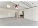 Spacious garage with epoxy flooring, refrigerator, and potential for a gym area at 506 S Casey Key Rd, Nokomis, FL 34275