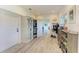Bright hallway with built-in storage and shoe rack at 506 S Casey Key Rd, Nokomis, FL 34275