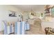 Bright kitchen with white cabinets, wooden island, and stainless steel appliances at 506 S Casey Key Rd, Nokomis, FL 34275