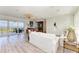 Bright and airy living room featuring water views, bar, and stylish furnishings at 506 S Casey Key Rd, Nokomis, FL 34275