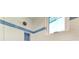 Modern shower featuring stylish blue and white tile and recessed shelving at 506 S Casey Key Rd, Nokomis, FL 34275