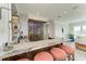 Wet bar features marble countertop, wooden cabinets, wine storage and vintage-style fixtures at 506 S Casey Key Rd, Nokomis, FL 34275