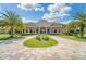 Beautiful clubhouse with landscaping and a grand entrance at 5622 Mulligan Way, Bradenton, FL 34211