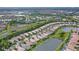 Aerial view of The Isles at Palmer Ranch community, showcasing homes and lakes at 5759 Benevento Dr, Sarasota, FL 34238