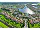 Aerial view of community with lake, pool, and tennis courts at 5759 Benevento Dr, Sarasota, FL 34238
