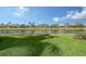 Lakefront property with lush green grass at 5759 Benevento Dr, Sarasota, FL 34238
