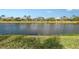 Serene backyard view of the lake at 5759 Benevento Dr, Sarasota, FL 34238