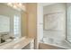 Bathroom with soaking tub, double vanity, and large mirror at 5759 Benevento Dr, Sarasota, FL 34238
