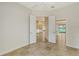 Bright bedroom with access to other rooms and tile flooring at 5759 Benevento Dr, Sarasota, FL 34238