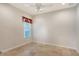 Cozy bedroom with window, tile flooring, and ceiling fan at 5759 Benevento Dr, Sarasota, FL 34238
