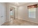 Bedroom with mirrored closet and window with window treatment at 5759 Benevento Dr, Sarasota, FL 34238