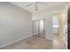 Bright bedroom with tile floors and mirrored closet doors at 5759 Benevento Dr, Sarasota, FL 34238