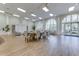 Clubhouse dining area with a large table and comfortable chairs at 5759 Benevento Dr, Sarasota, FL 34238