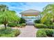 Lakeside gazebo with seating and brick pathways at 5759 Benevento Dr, Sarasota, FL 34238