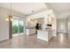 Kitchen with island, granite countertops, and breakfast nook at 5759 Benevento Dr, Sarasota, FL 34238