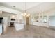 Island kitchen with stainless steel appliances and granite counters at 5759 Benevento Dr, Sarasota, FL 34238