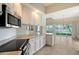 Bright kitchen with stainless steel appliances and granite countertops at 5759 Benevento Dr, Sarasota, FL 34238