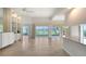 Spacious living room with tile floors and water views at 5759 Benevento Dr, Sarasota, FL 34238